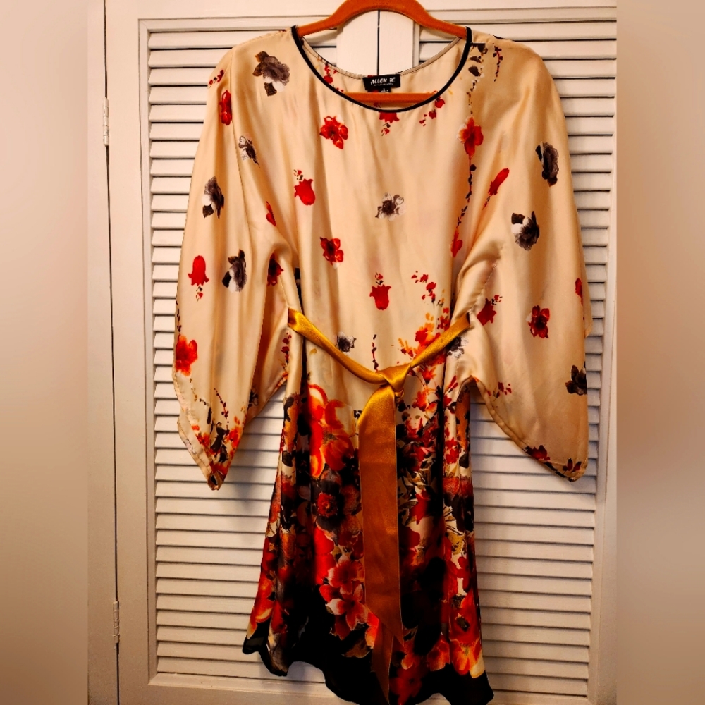 Dress or belted batwing top. Creme colored white water colored floral pattern.